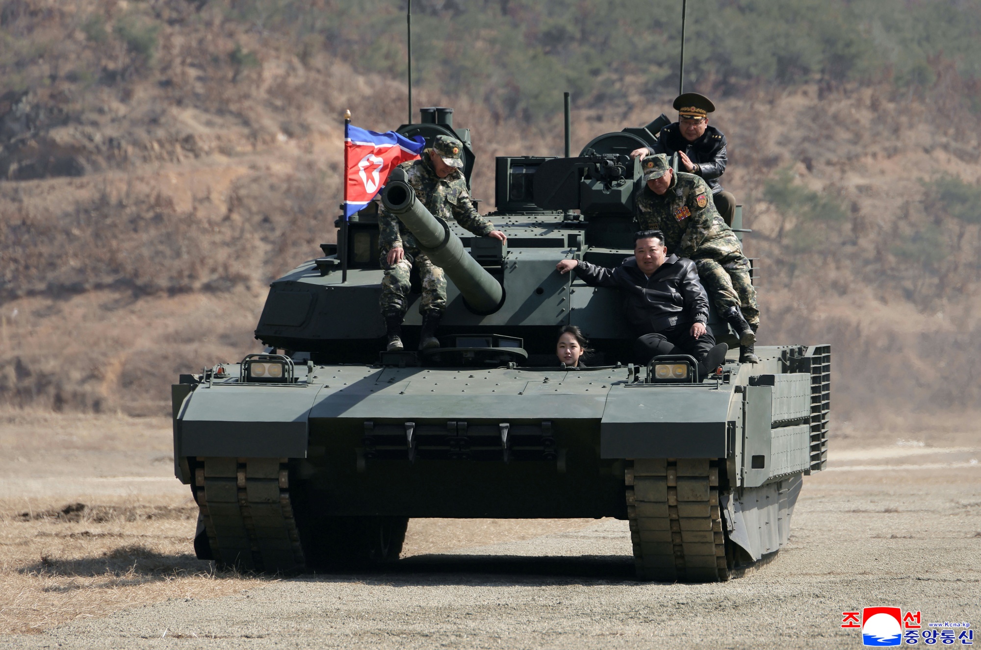 Kim Jong Un, front right, with his daughter Kim Ju Ae and other soldiers on a tank at a military training base, in a photo provided by the North Korean government.
