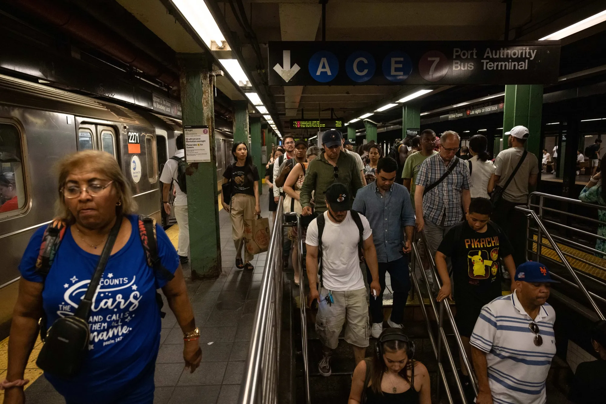 Commuters at the Times Square subway station in New York.