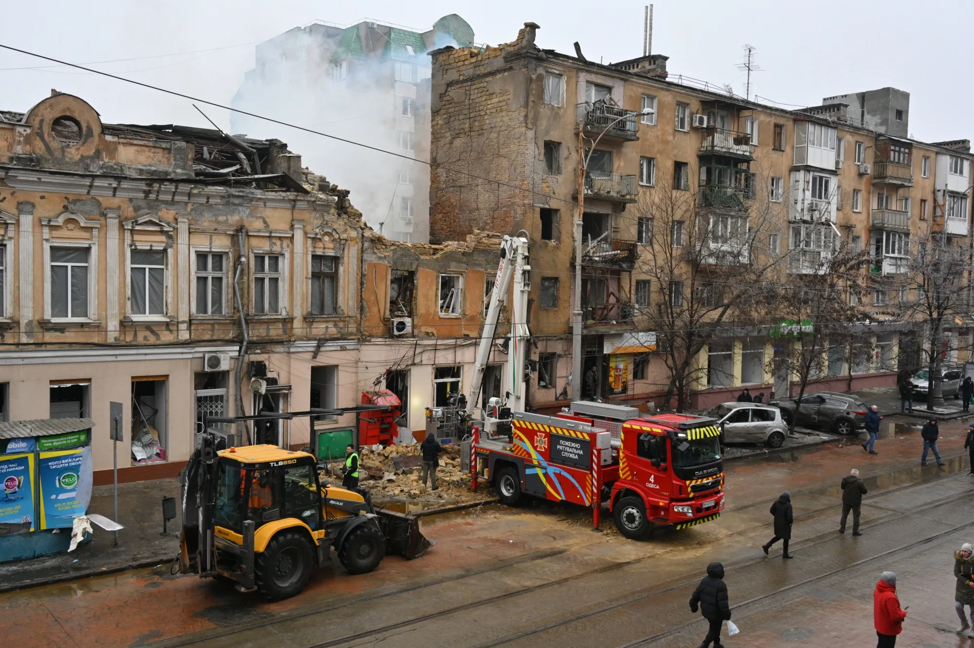 Emergency services at the site of a Russian attack, in Odesa, Ukraine, on Jan. 27.