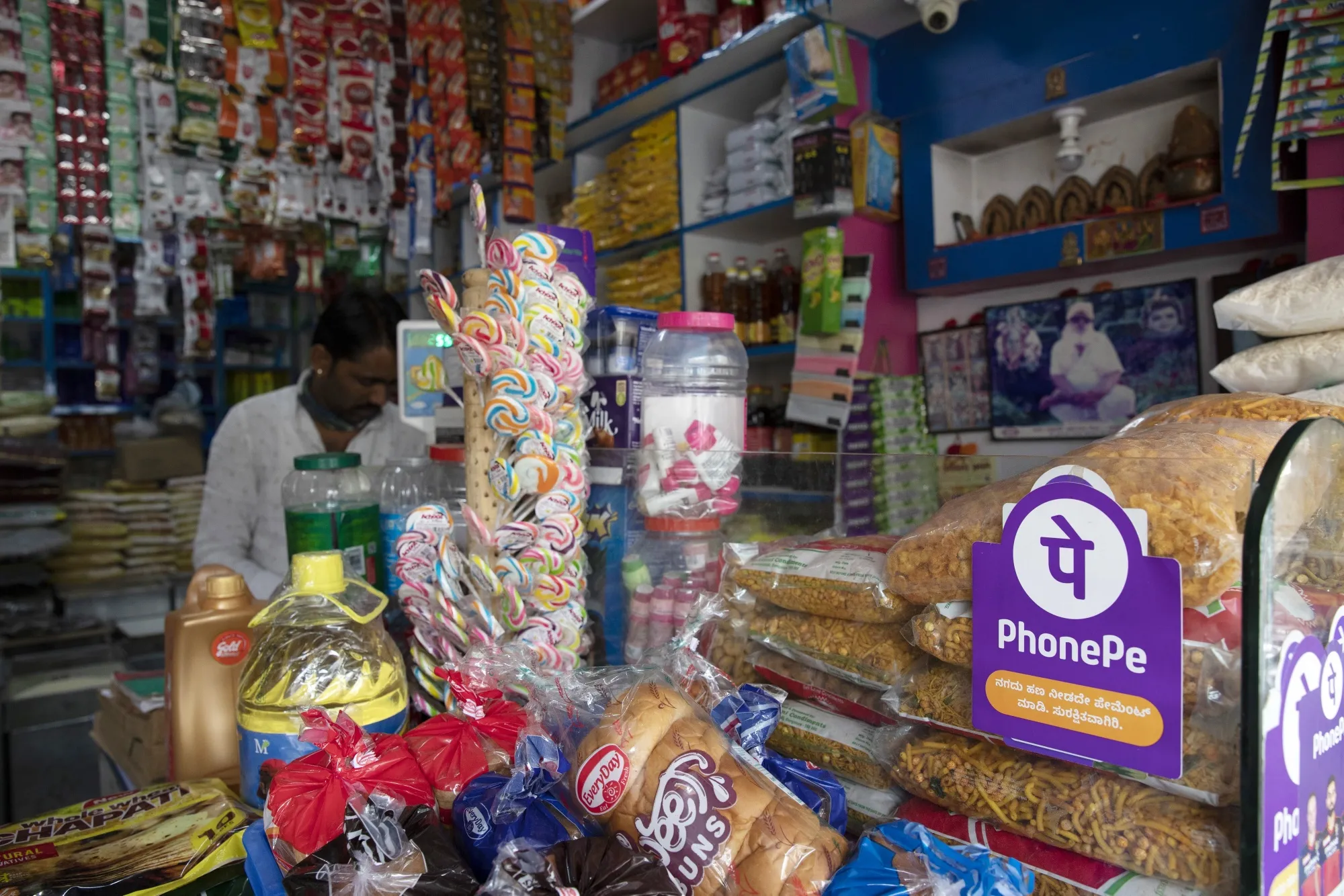 A grocery store advertises the use of the PhonePE digital payment system in Bengaluru, India.