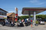 Motorcyclists wait in line at a&nbsp;gas station in Cucuta, Colombia.