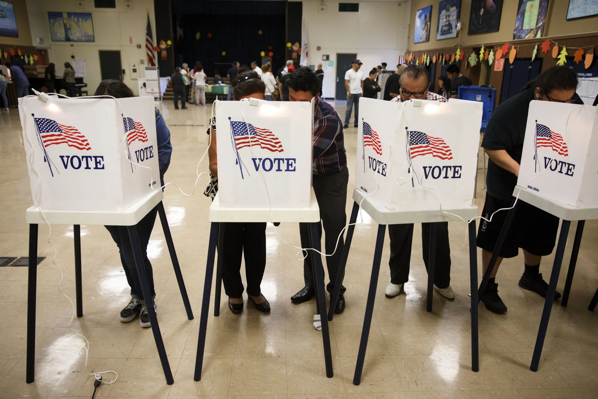 Voters cast ballots at the Brooklyn Avenue Elementary School in Los Angeles, California, U.S., on Tuesday, Nov. 8, 2016.