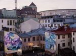 Lights on in homes and businesses at dusk in Gothenburg, Sweden.