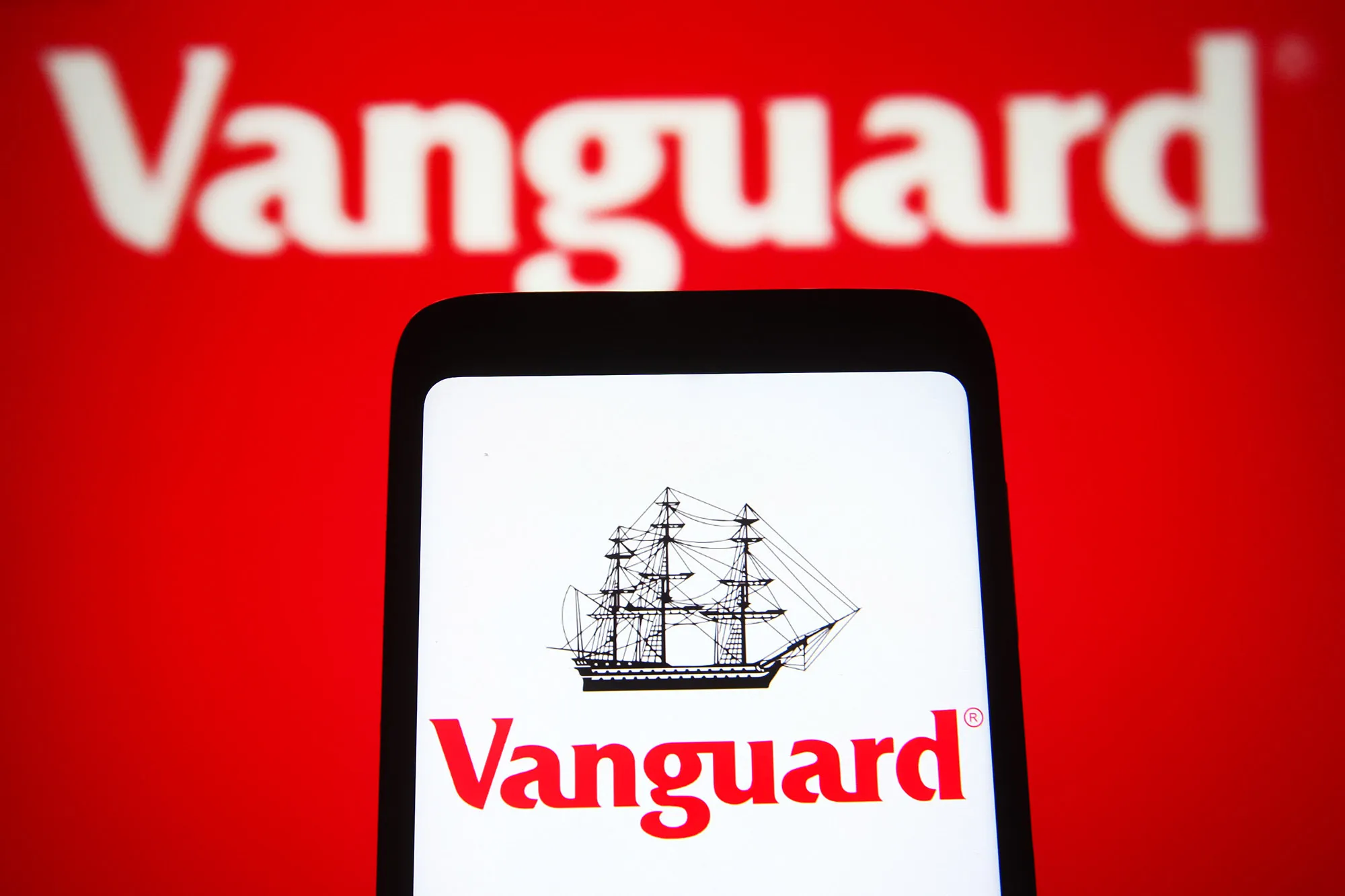 In this photo illustration, the Vanguard Group Inc. logo is