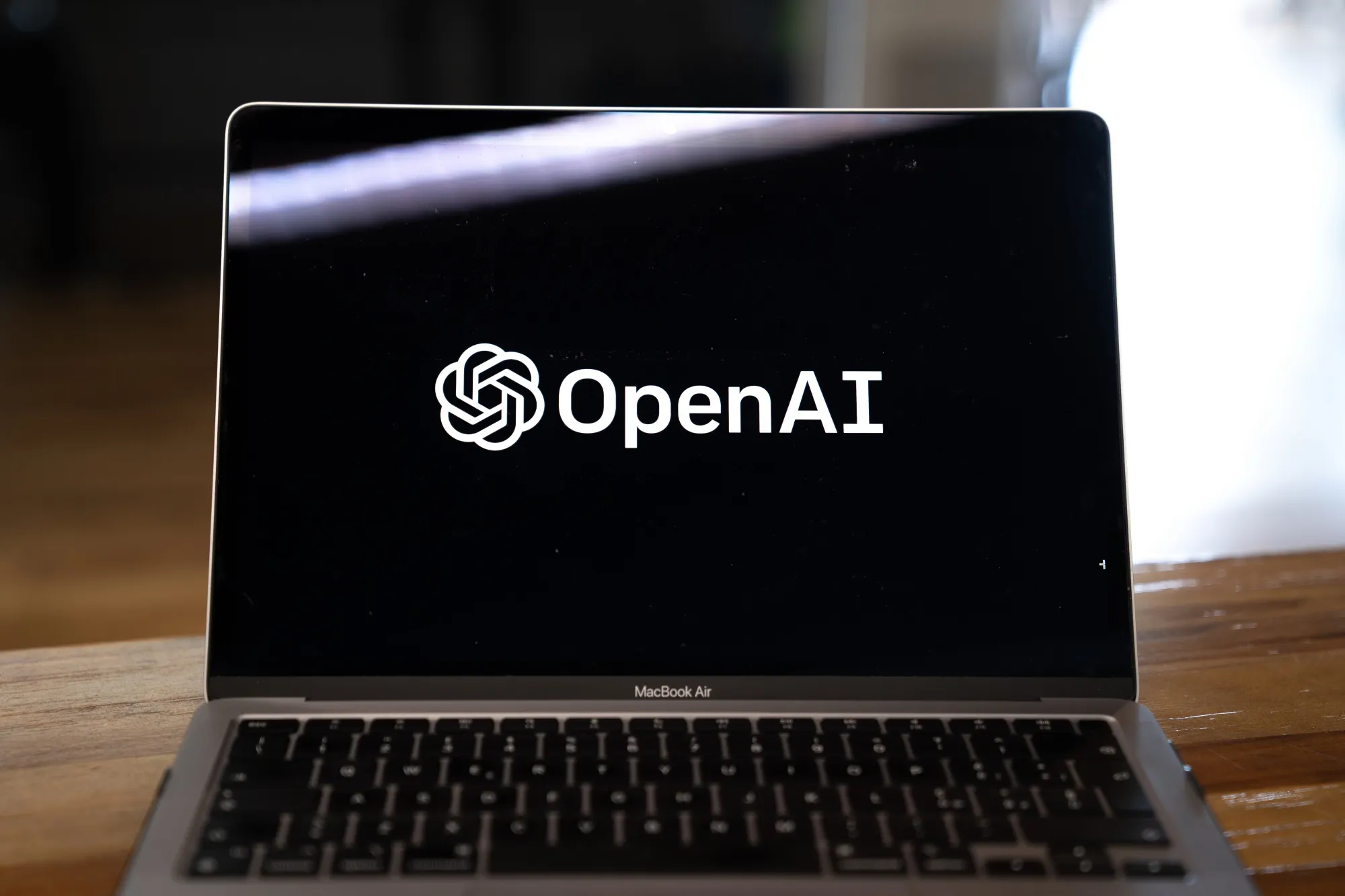 The OpenAI logo arranged on a laptop in Beijing, China, on Friday, Feb. 24, 2023.