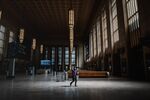 A man wearing a protective mask walks through an almost empty 30th Station in Philadelphia on April 15.
