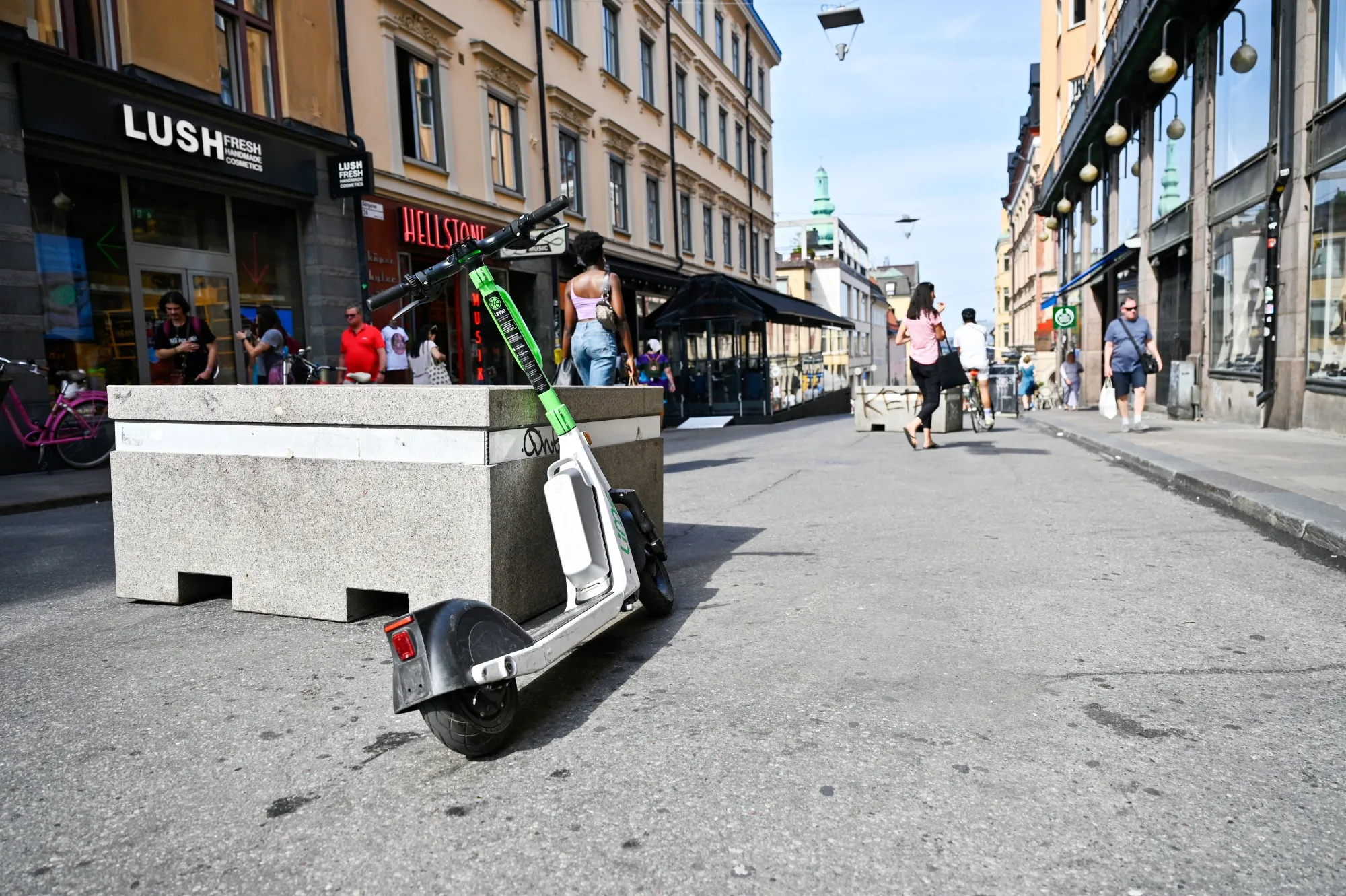 An abandoned public hire e-scooter on a shopping street in Stockholm, Aug. 18.