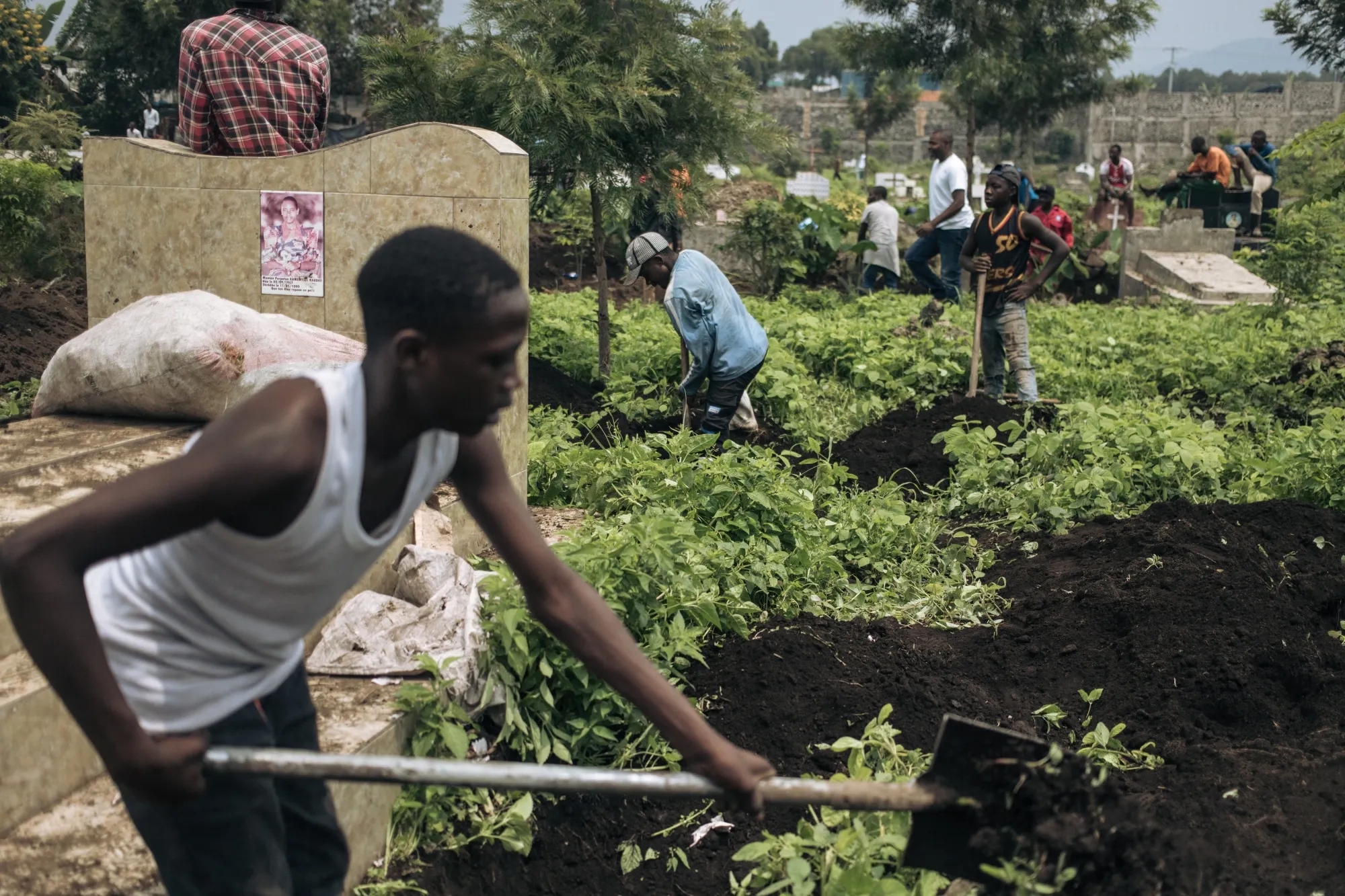 Graveyard workers dig graves in a cemetery in Goma, on Feb. 3.&nbsp;