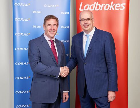 Gala Coral Group Ltd. CEO Carl Leaver, left, shakes hands with Ladbrokes Plc. CEO Jim Mullen in London. Photographer: Charles Shearn via Bloomberg