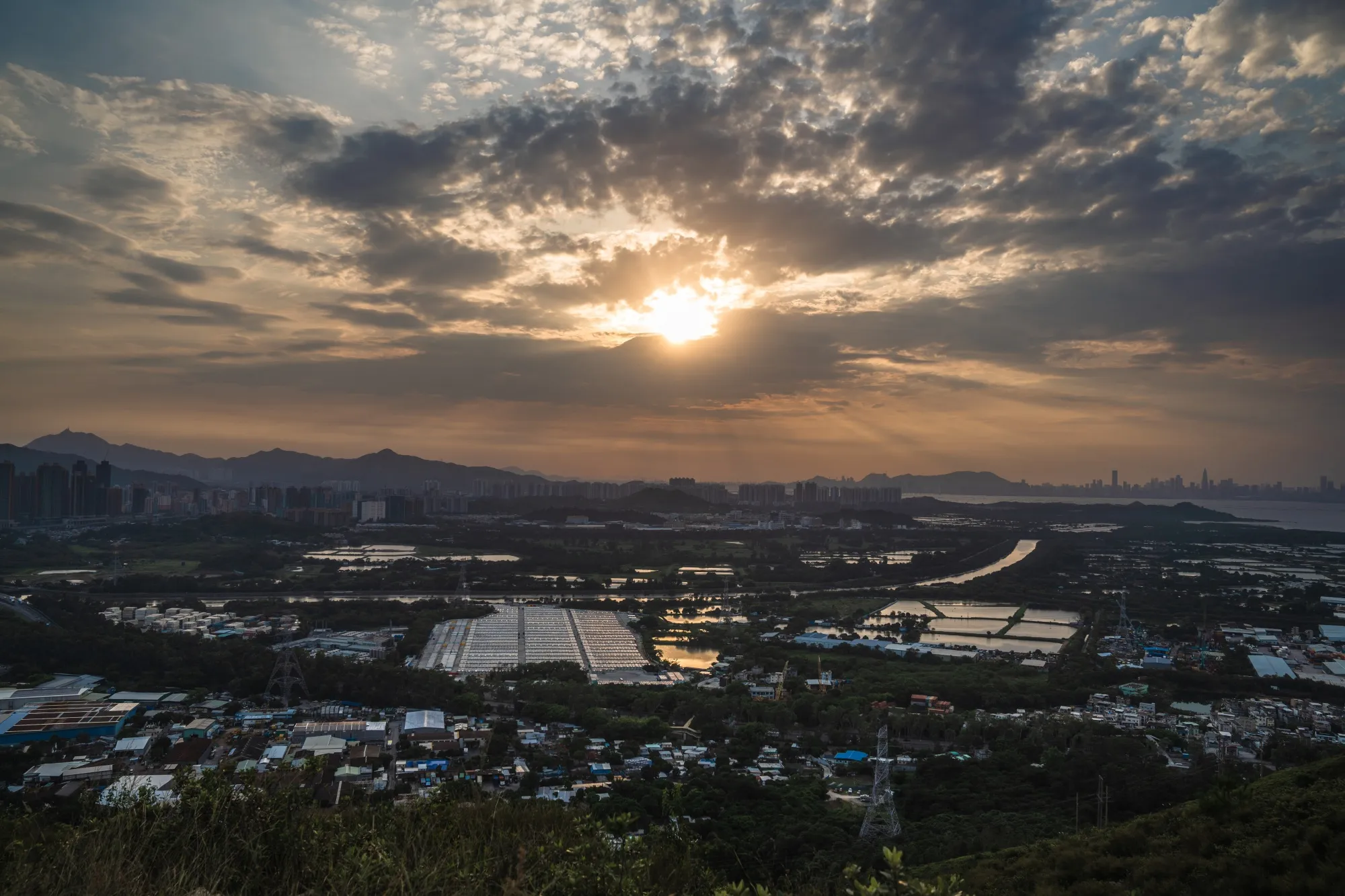A proposed residential land plot on the fringe of a wetland conservation area in Hong Kong.