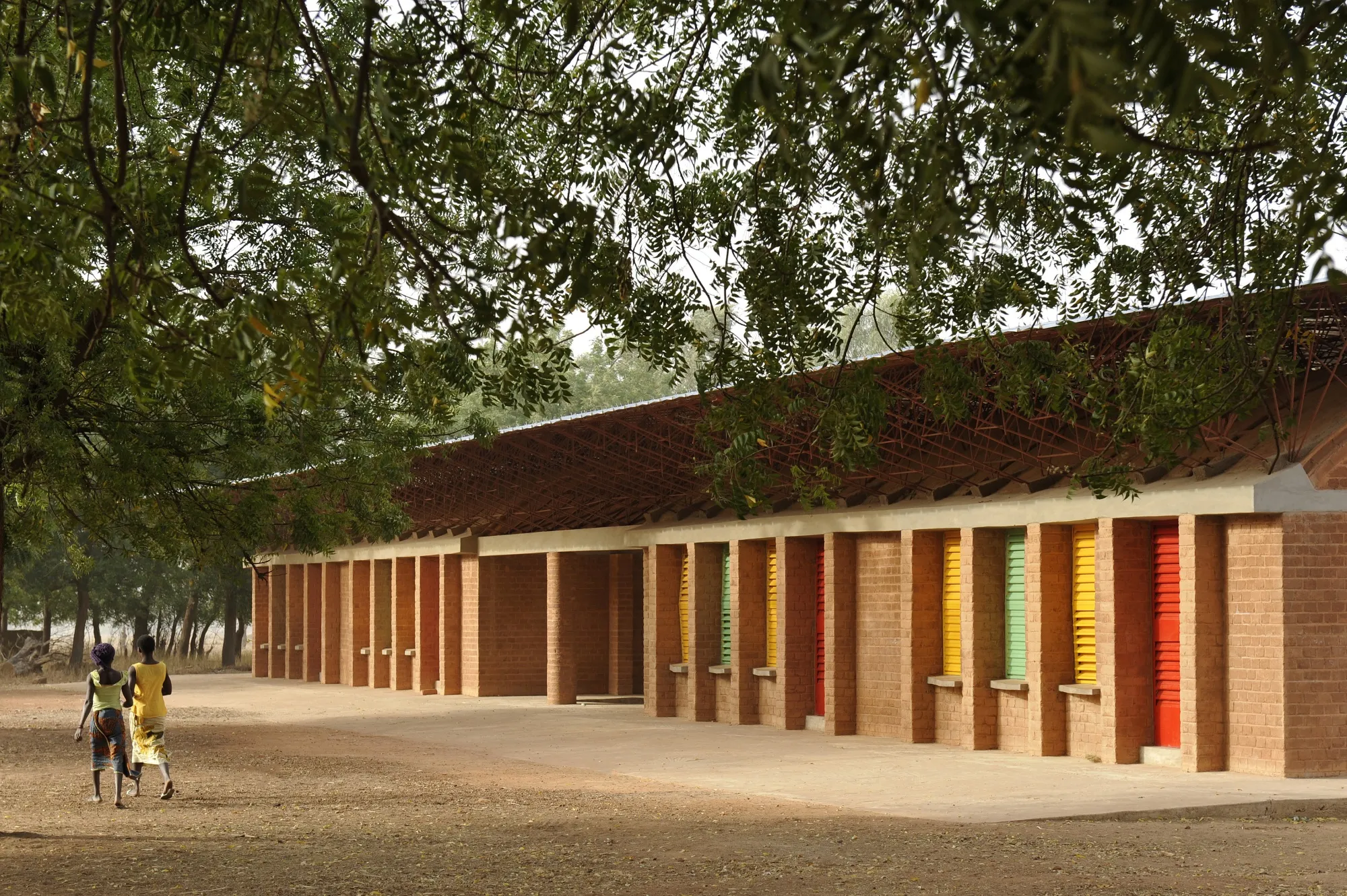 The&nbsp;Gando Primary School, the Kéré Foundation’s inaugural project in 1998, uses bricks made from local clay and a wide, overhanging&nbsp;roof to retain cooler air inside and promote circulation without air conditioning.
