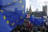 Demonstrators hold European Union (EU) on Parliament Square during a People's Vote march in London, U.K., on Saturday, Oct. 19, 2019. Boris Johnson is under pressure to ask the European Union to postpone Brexit after Parliament refused to approve the deal the prime minister negotiated.