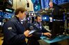 Traders work on the floor of the New York Stock Exchange (NYSE) in New York, U.S., on Monday, Nov. 12, 2018. U.S. stocks extended declines as Apple Inc. tumbled on signs of weak iPhone demand and General Electric Co. fell as much as 10 percent.
