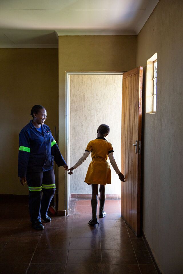 Monimang Segopa, 28, the janitor at Tsholetsega Public School in Johannesburg, South Africa and a young student in the restroom that the Clear Enviro Loo Recirculation Water Treatment Plant services.