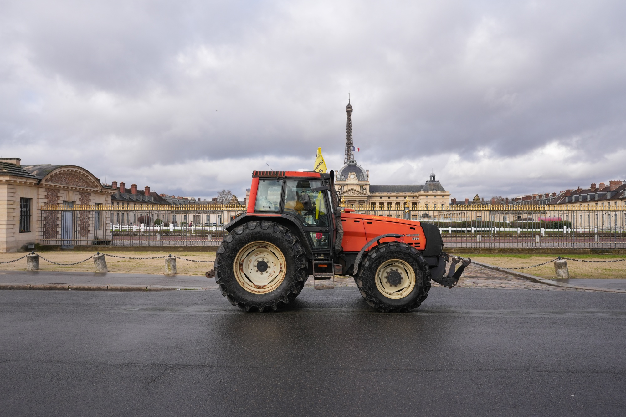 A French farmer drives a tractor towards Les Invalides during a protest in central Paris on Feb. 23. 2024.