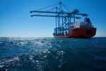 The Dockwise Swift heavy vessel transports Paceco Portainer STS gantry and Transtainer cranes to the Port of Long Beach in Long Beach, California, U.S..
