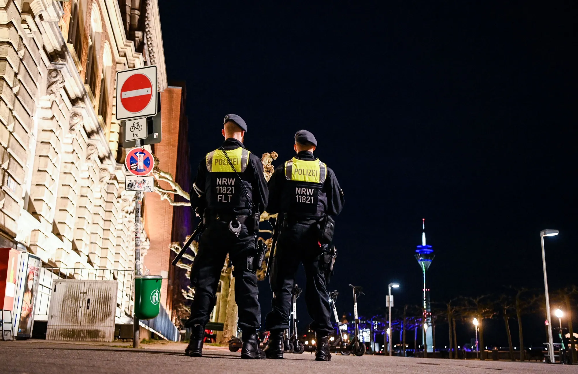 Police officers patrol&nbsp;the&nbsp;promenade by the Rhine during&nbsp;restrictions in Duesseldorf on April 24.