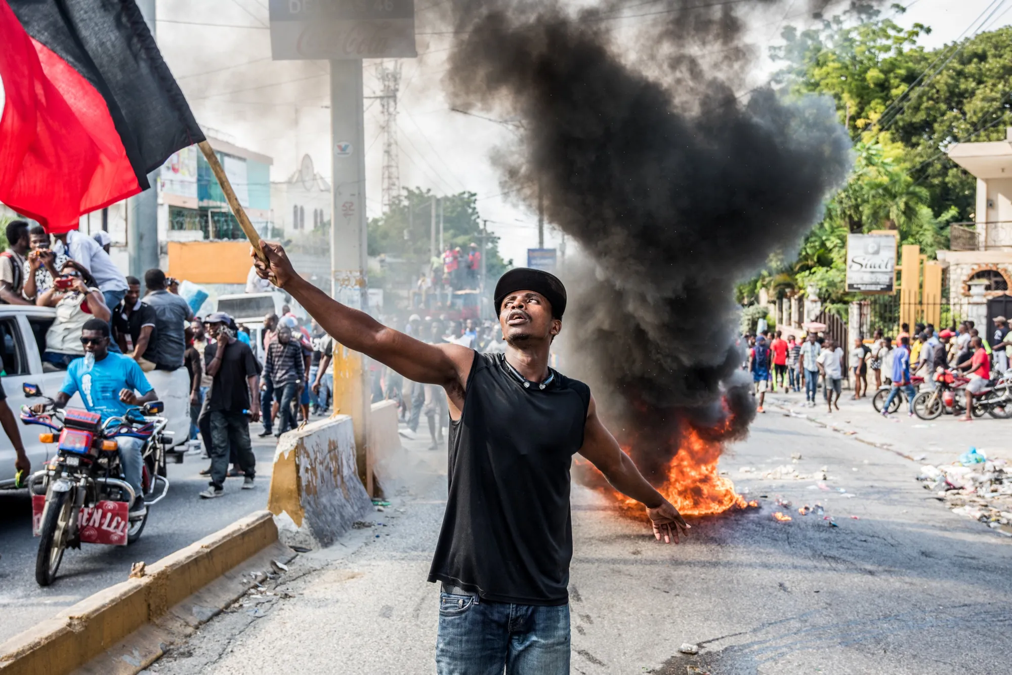 Protesters march at a demonstration for the resignation of President Moise, in Port-au-Prince on November 18.