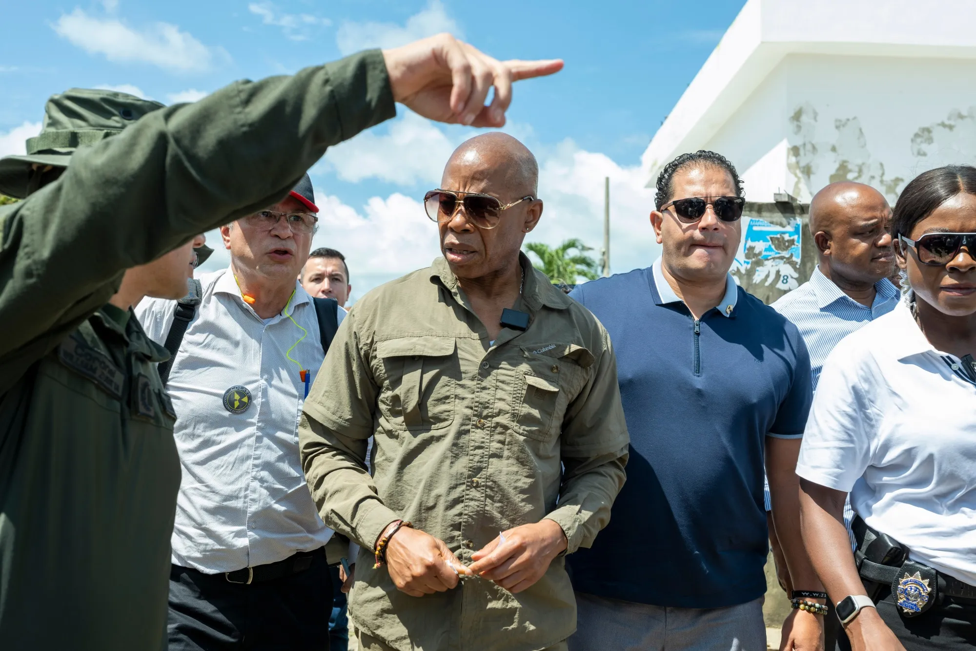 Mayor Eric Adams of New York, center, in Colombia on Oct. 7. During his Latin America tour, Adams visited the Darien Gap, where migrants and asylum seekers start the perilous journey northward.
