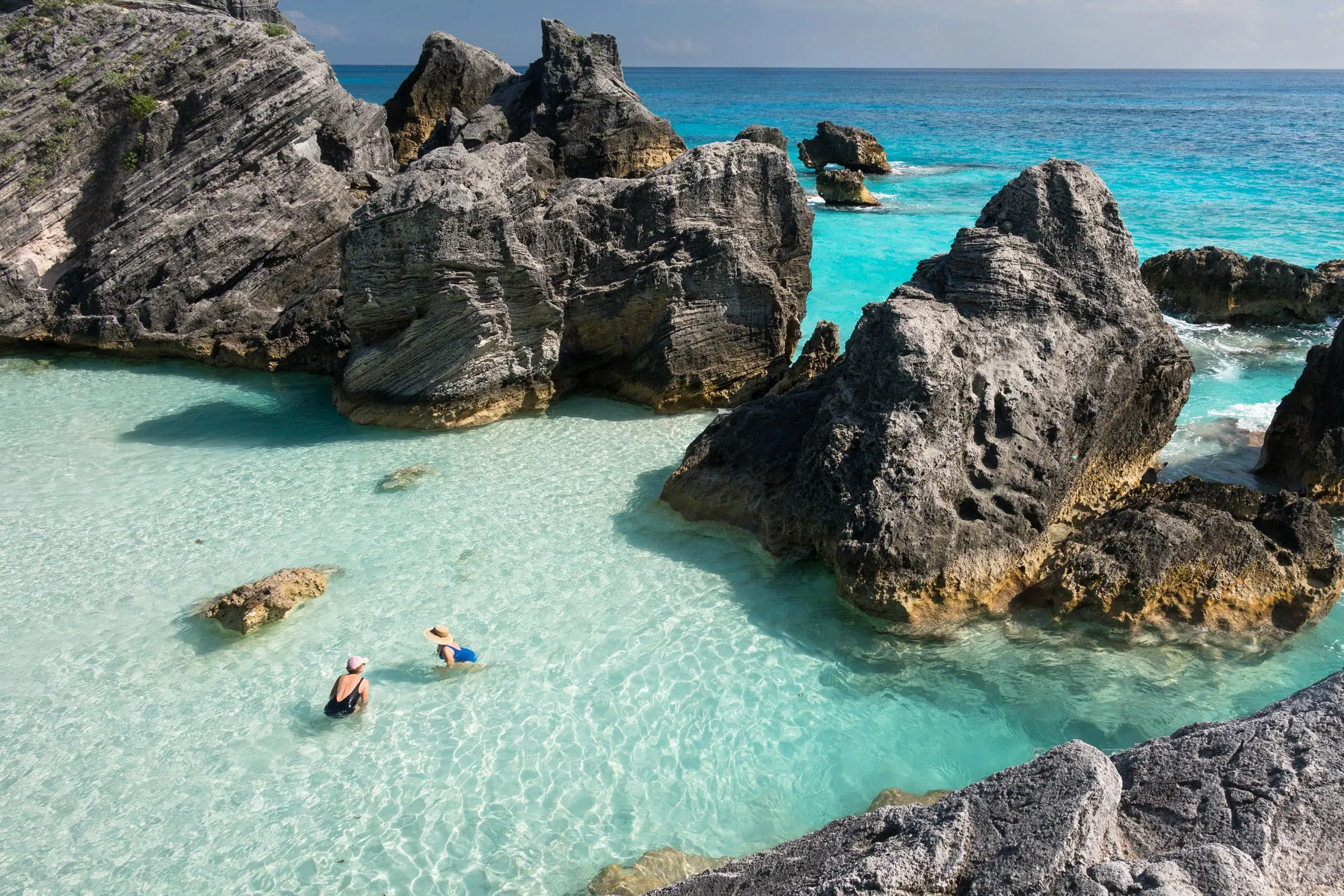 Tourists at Horseshoe Bay Beach, Bermuda.
