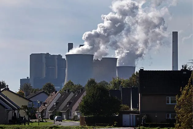 Cooling towers operate at the RWE coal-fueled power plant in Weisweiler, Germany