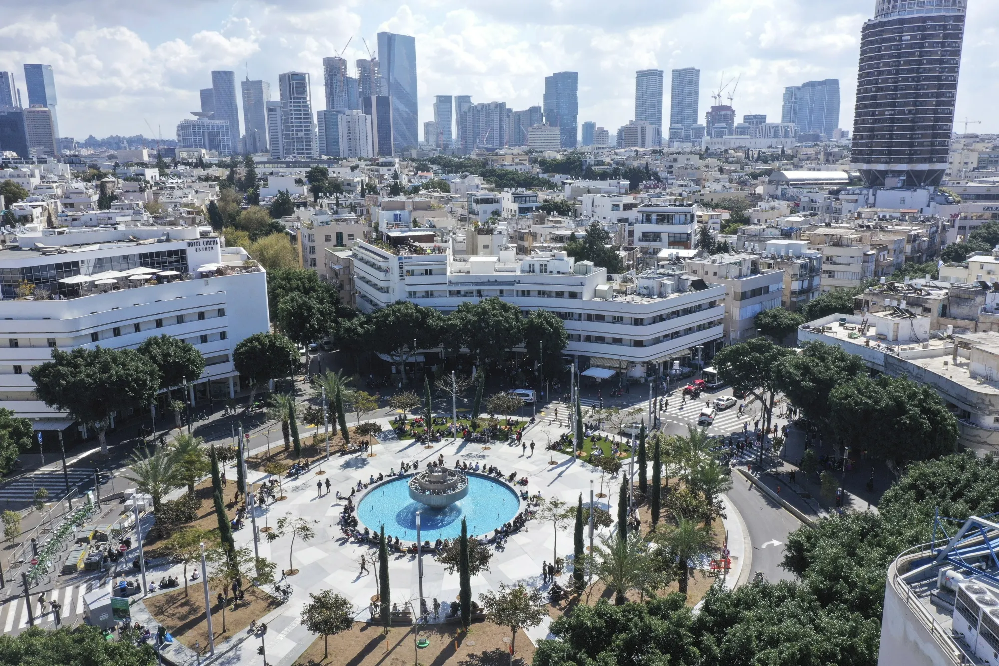 People relax on Dizengoff Square in Tel Aviv, Israel.