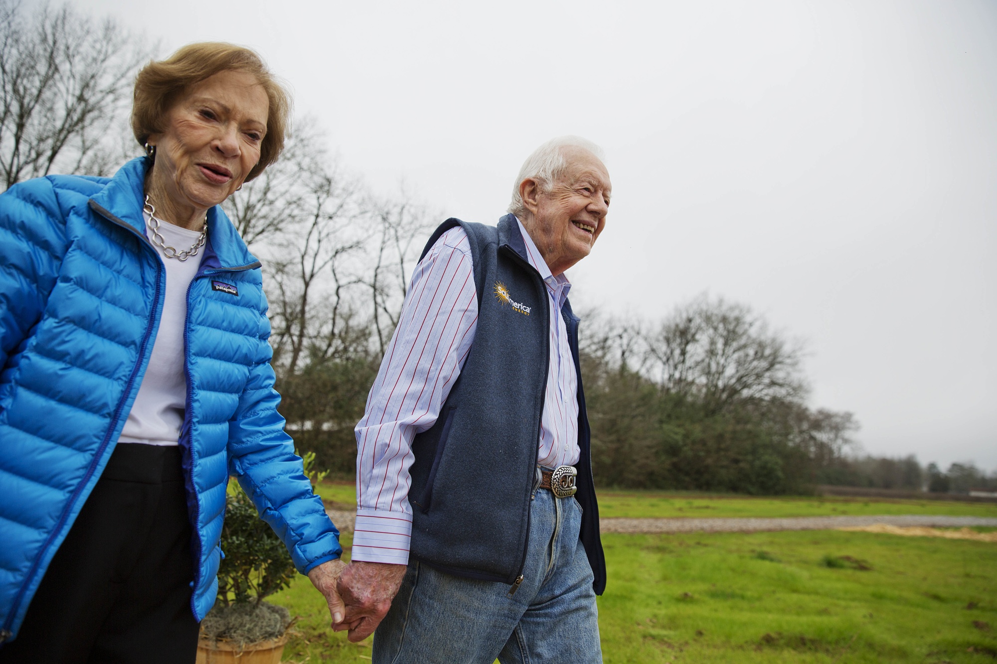 Jimmy Carter and his wife Rosalynn arrive for a ribbon-cutting ceremony for a solar project in Plains, Georgia, in 2017.