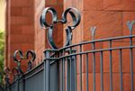 The Walt Disney Co. Mickey Mouse logo is seen on a fence at the company's studios in Burbank, California, U.S., on Monday, May 9, 2016.
