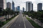 A near-empty road runs through the central business district in Jakarta, April 1.