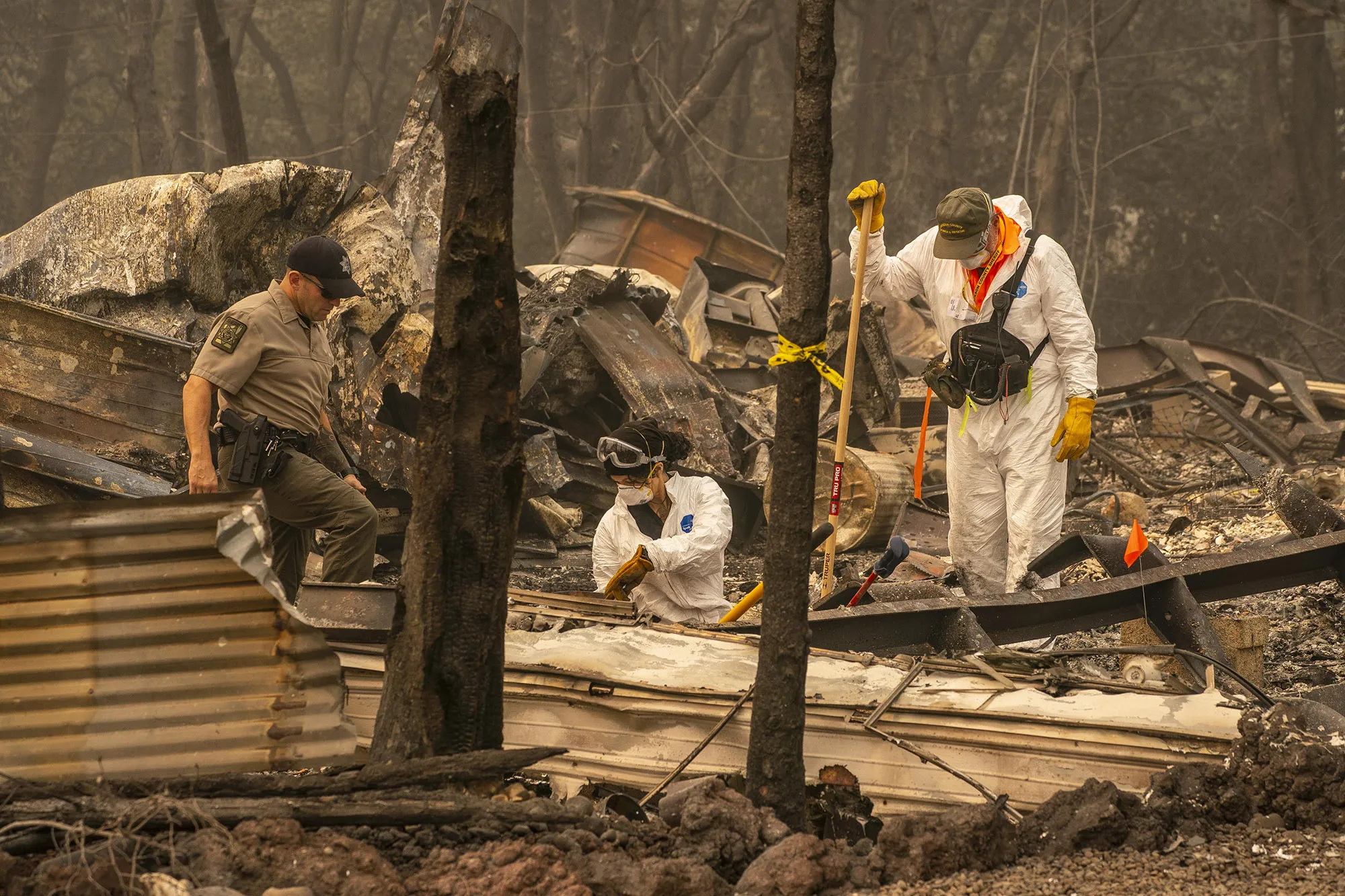 Search and rescue personnel from the Jackson County Sheriff’s Office look for the possible remains of a missing elderly resident in a mobile home park in Ashland, Oregon,&nbsp;on September 11.&nbsp;