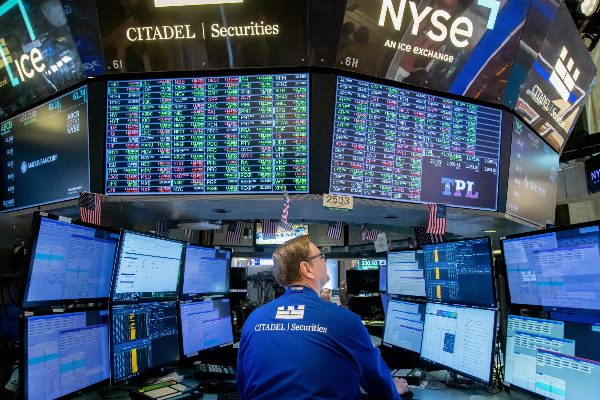 A trader works on the floor of the New York Stock Exchange.