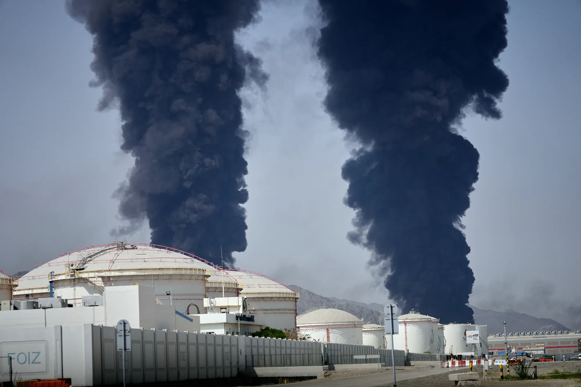Plumes of smoke rise after debris from an intercepted Iranian drone struck an oil facility in Fujairah, United Arab Emirates on March 14.
