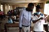 A nurse registers a patient to receive the Pfizer-BioNTech in Kampala, Uganda on Sept. 29.