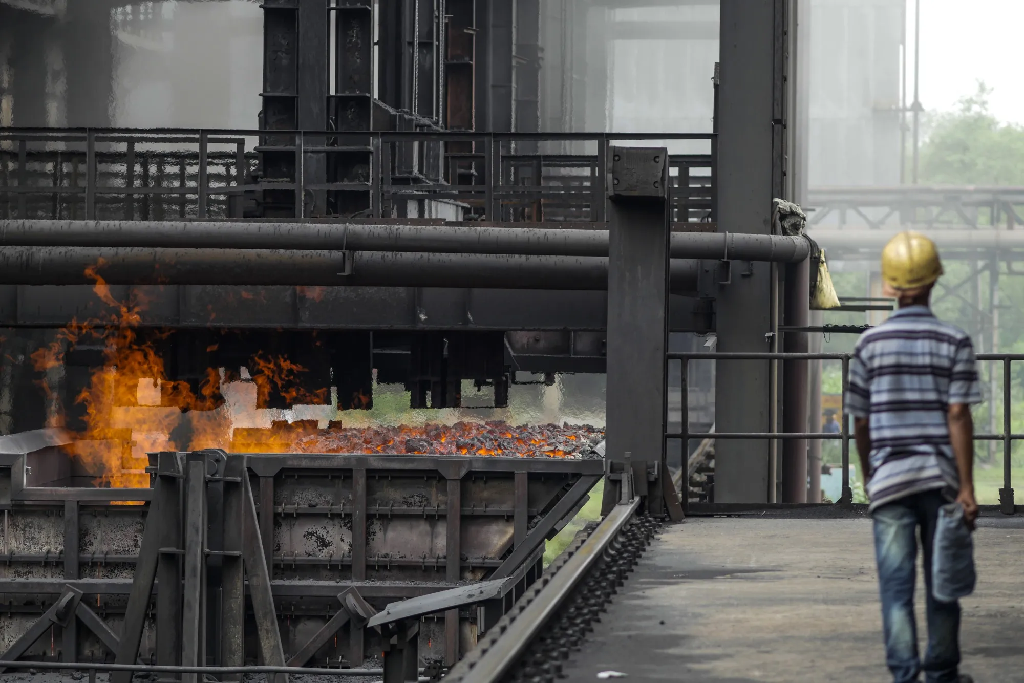 Flames rise from a wagon loaded with coke at a steel plant in Odisha, India.