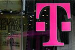 A T-Mobile US Inc. logo is displayed on a store location in New York, U.S.