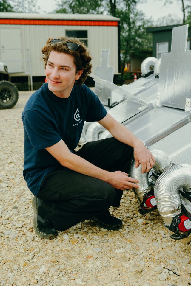Evan Lipofsky of Atmos Thermal Systems doing work outside.