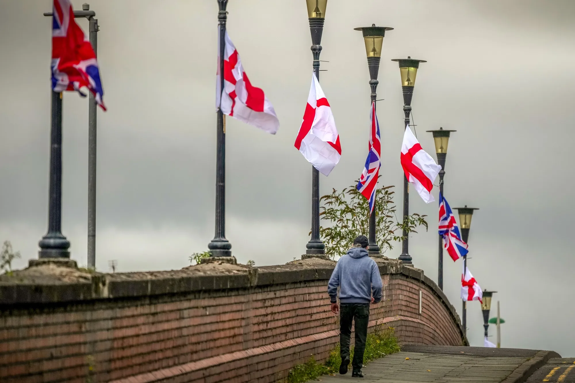 The flag of St George and Union Flags hang from lamp posts on Westminster Bridge in Ellesmere Port, UK, on Aug. 28.