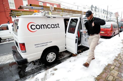 A Comcast field service technician arrives to install cable service at a residence in Reading, Pa., on Jan. 19, 2011.