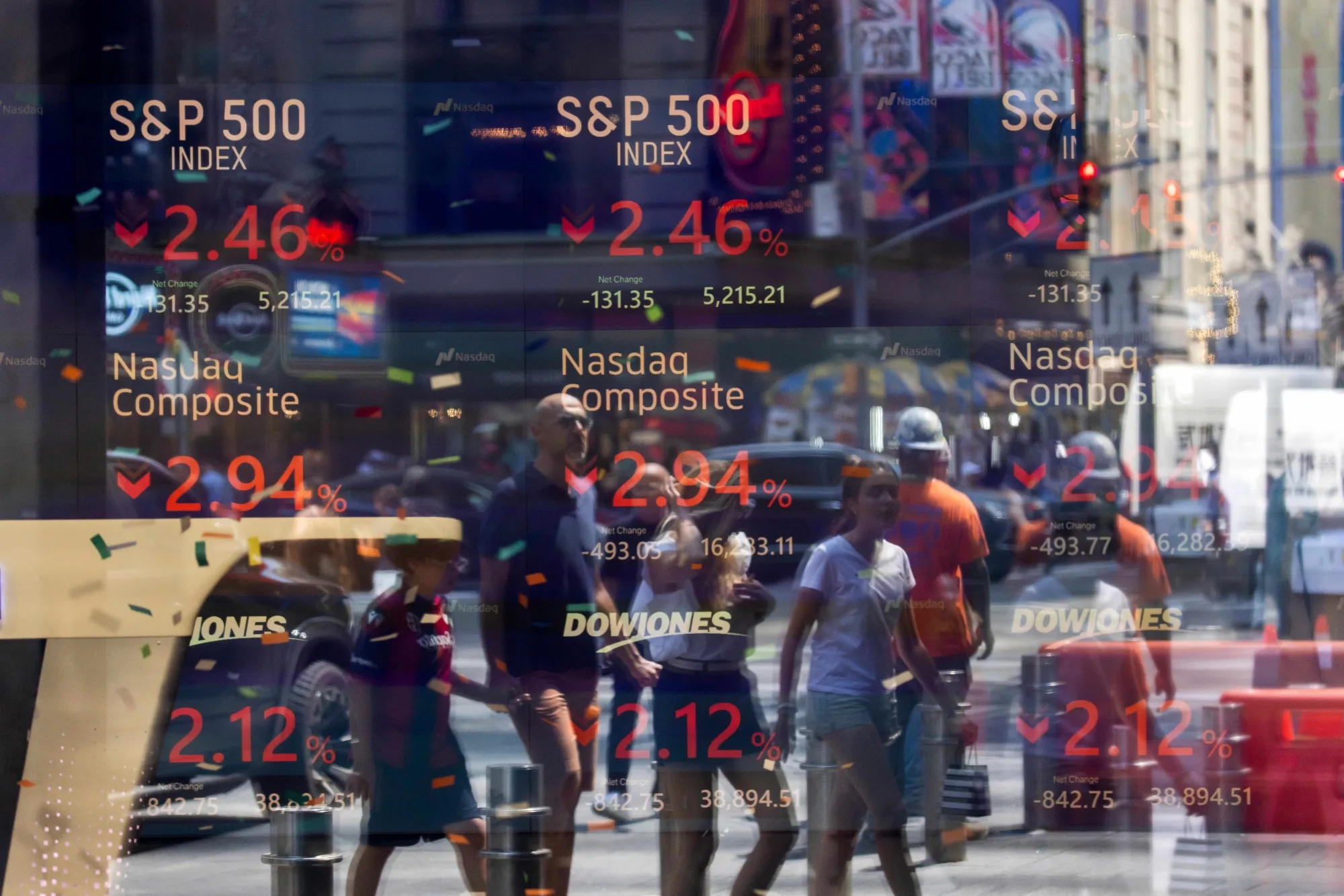 Stock market information displayed at the Nasdaq MarketSite in New York, on Aug. 5.