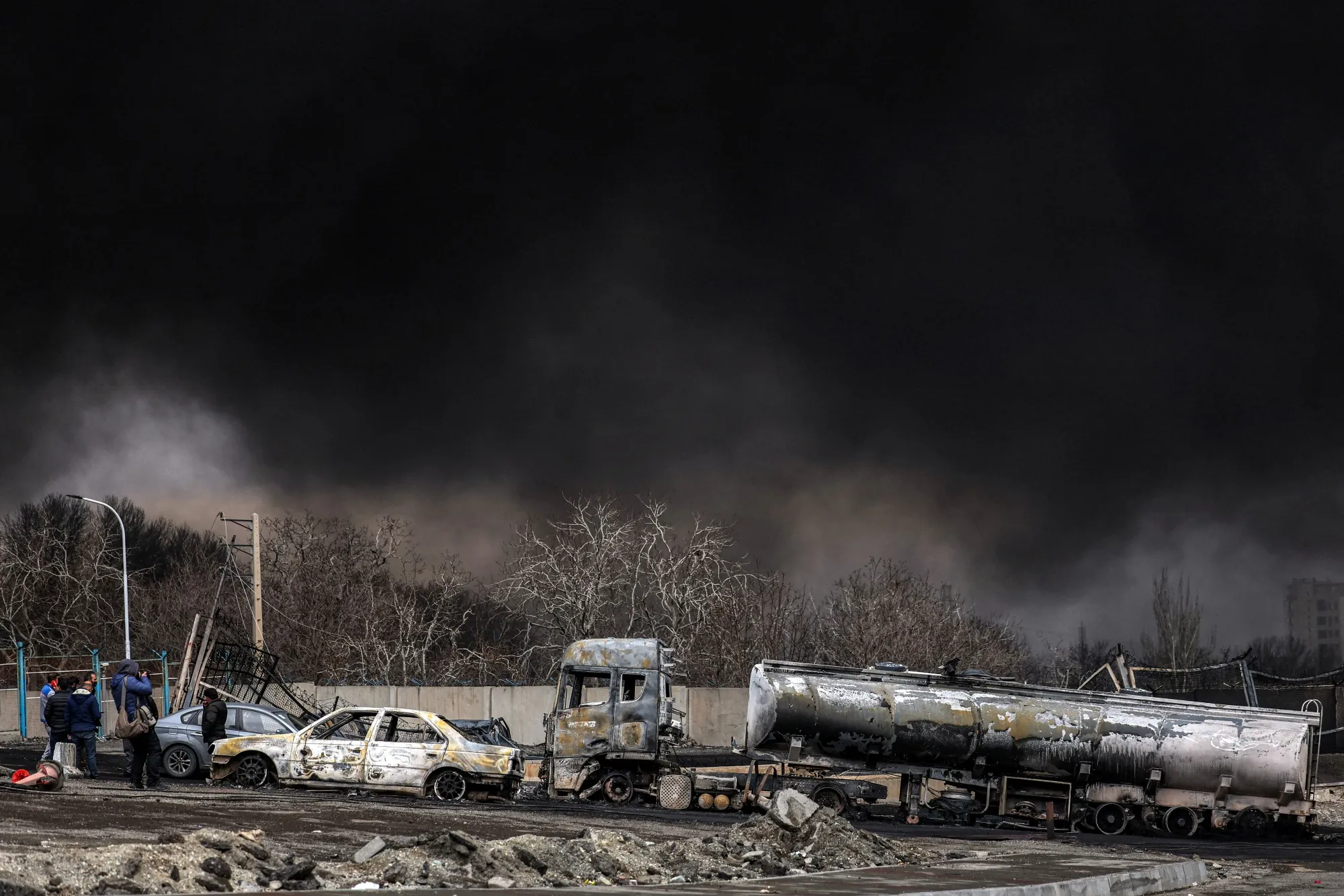 Black smoke rising from an ongoing fire following an airstrike on Tehran’s Shahran oil facility.