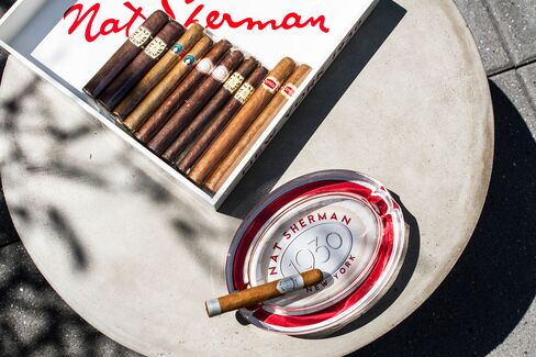 St. Cloud's Nat Sherman cigars are served atop industrial concrete tables in the outdoor cigar lounge.