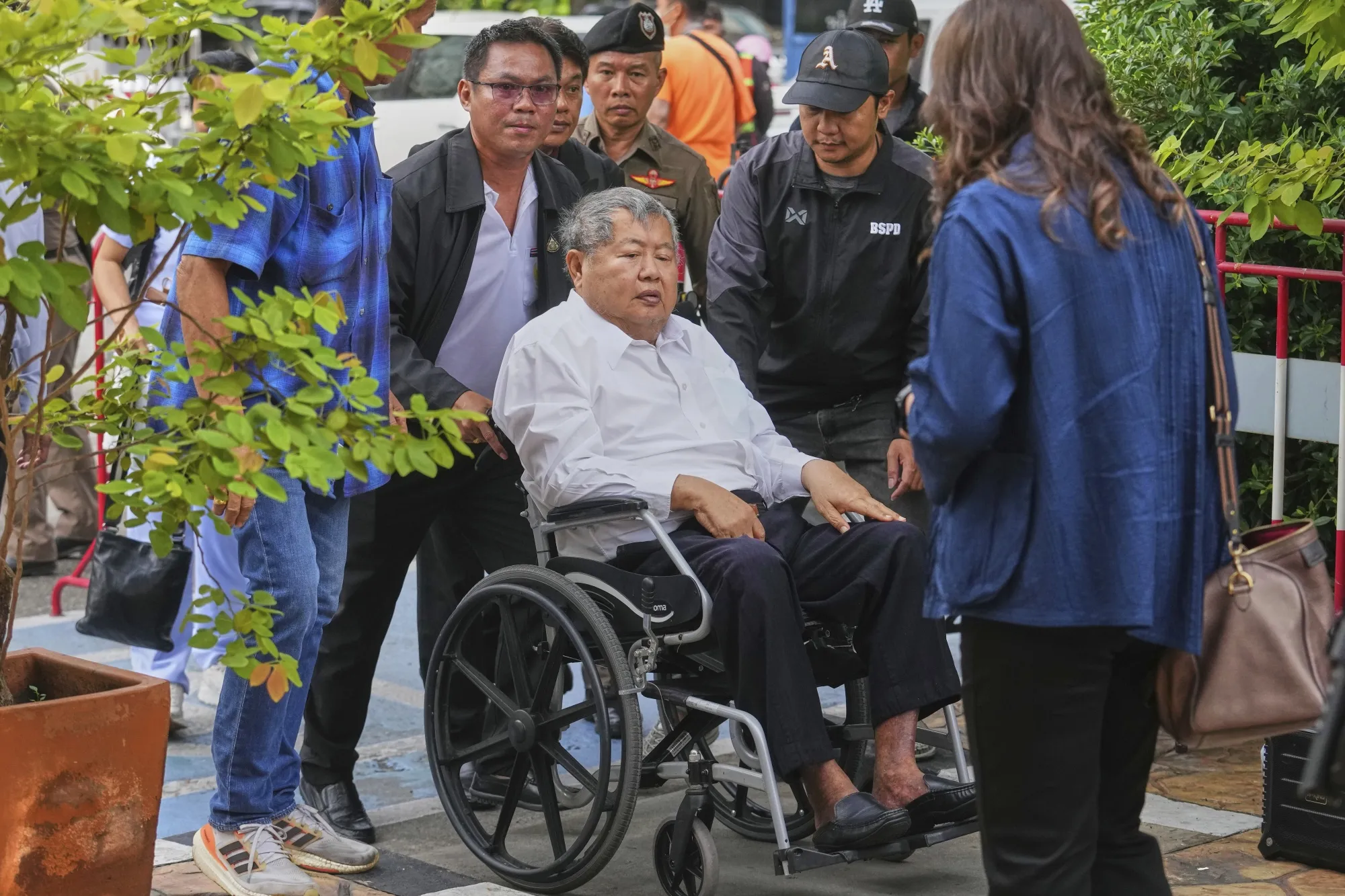 Premchai Karnasuta arrives at Bang Sue Police Station in Bangkok on May 16.