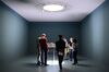 Visitors at the 2018 edition of Art Basel gathering around "The tip of the Iceberg" by artist Barbara Bloom.