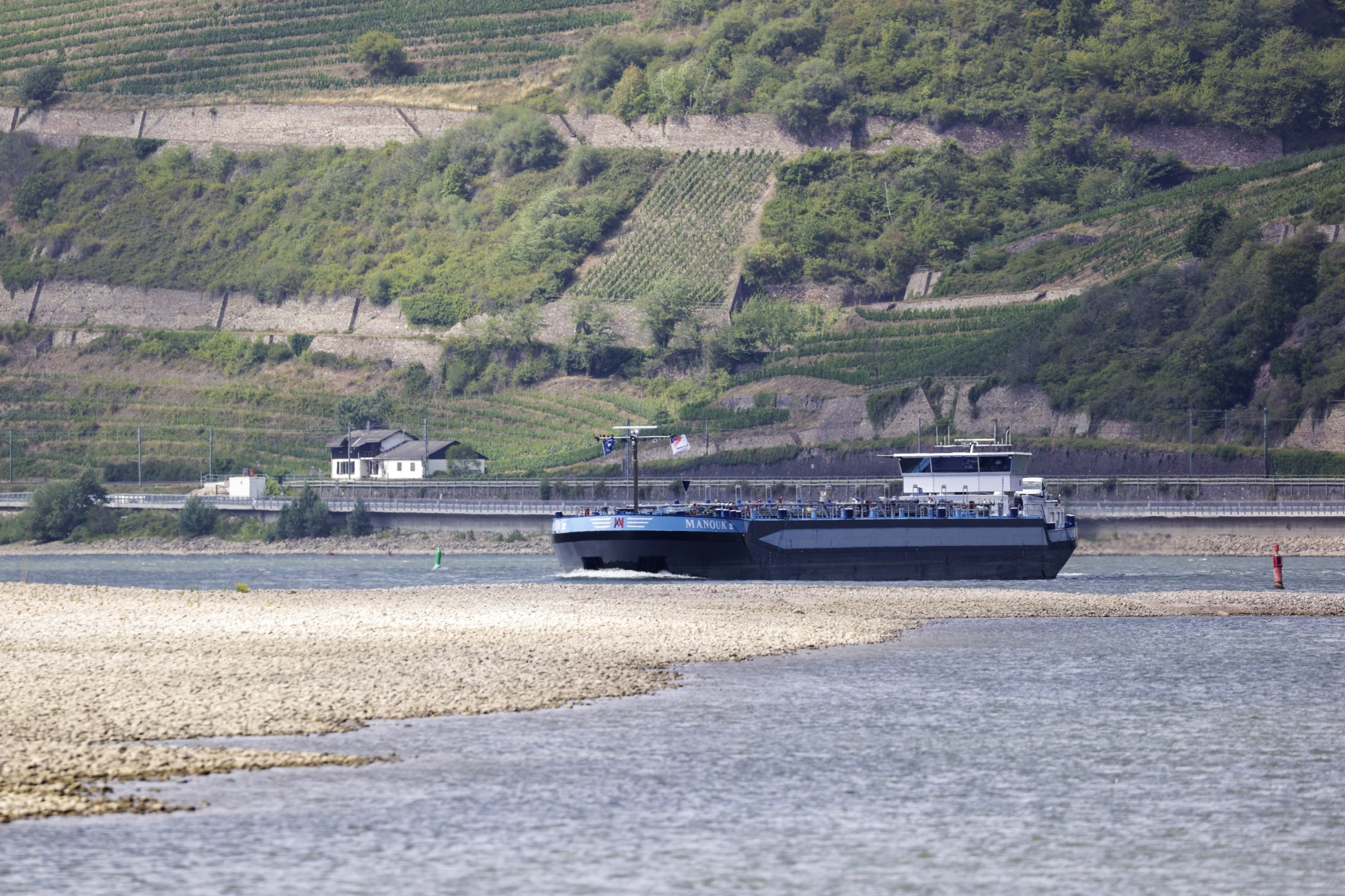 An oil and chemical tanker&nbsp;sails past dry banks on the Rhine River near Assmanshausen, Germany, on July 14.