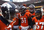 Denver Broncos players celebrate after making an interception during a game in Denver, Colorado in Oct. 2021.&nbsp;