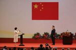Carrie Lam, Hong Kong's incoming chief executive, left, recites the oath of office as Xi Jinping, China's president, looks on in Hong Kong.
