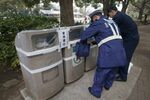 Police officers seal off trash bins prior to the Tokyo Marathon in Tokyo in 2015.