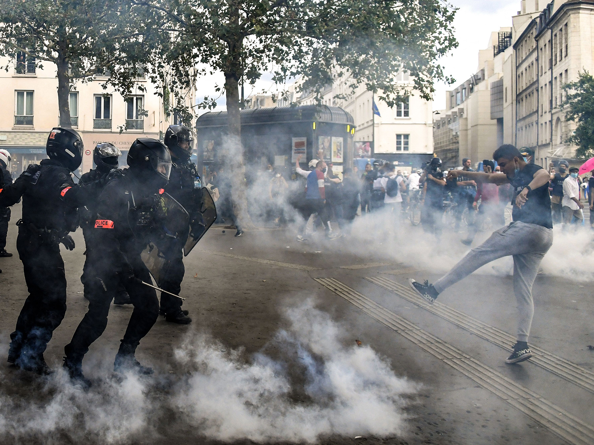Demonstrators clash police during anti vaccine passport&nbsp;protests, in Paris, on July 31.
