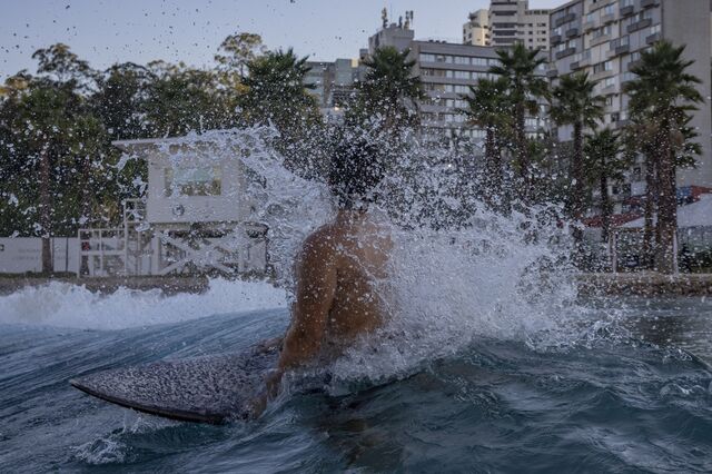 Water splashes around a surfer in the surf pool at the Sao Paulo Surf Club. 