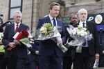 Britain's Prime Minister David Cameron and Labour Party Leader Jeremy Corbyn at a memorial for murdered MP Jo Cox.